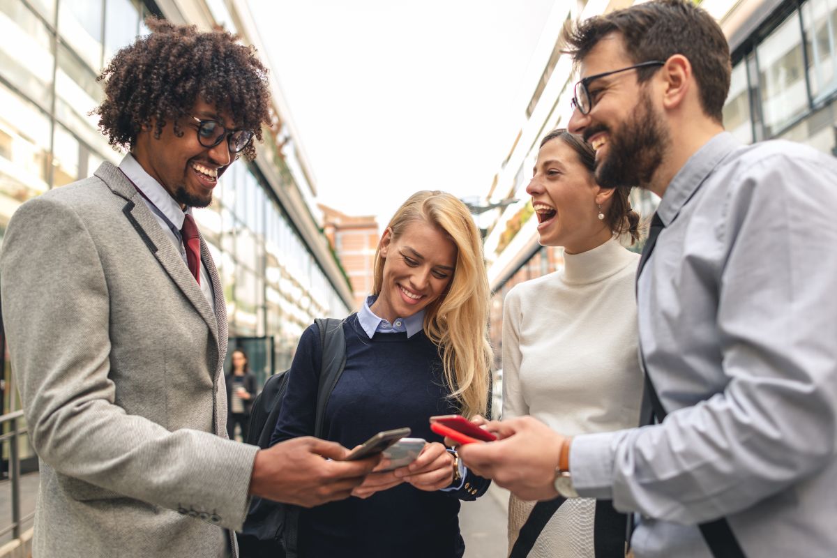 The photo shows a group of people networking.