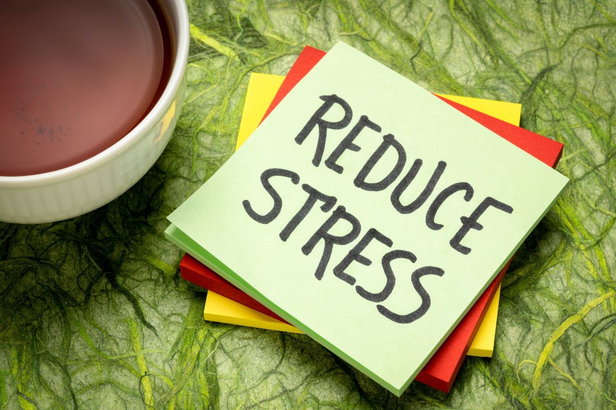 The photo tells about a coffee and stickers with notes indicating to having more ways reduces stress and financial strain and more control you have over your money.