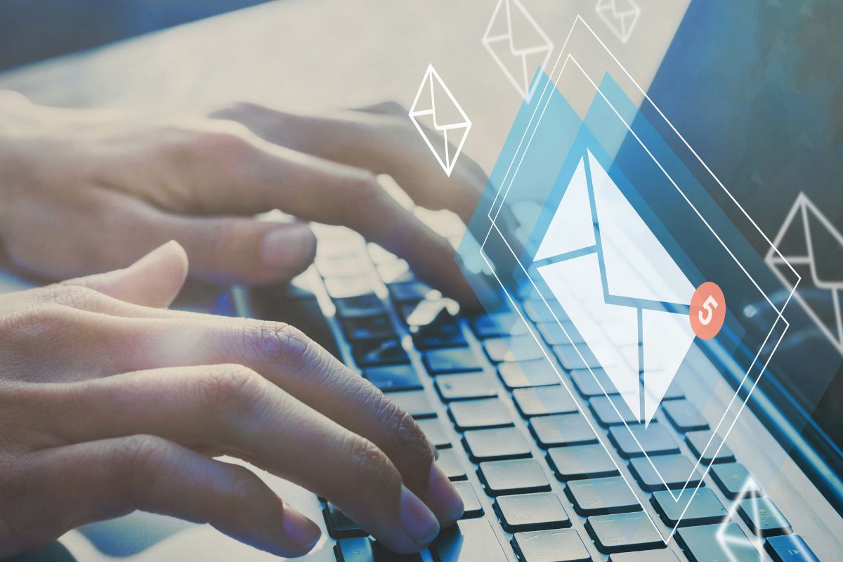 The photo shows a man's hand subscribing to emails.