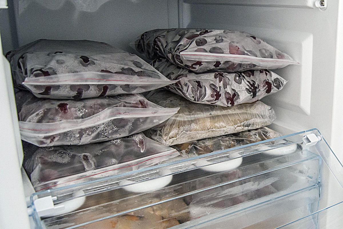 The photo shows frozen fruits in a fridge.