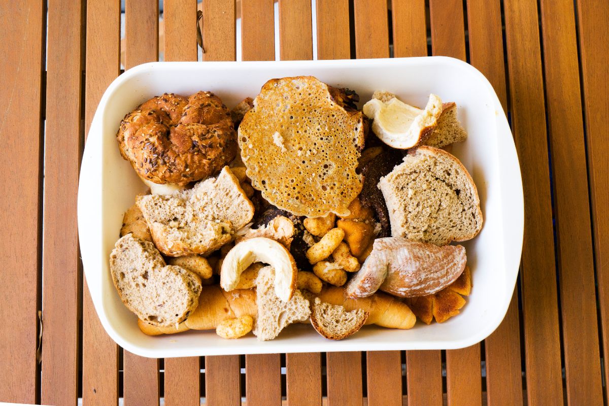 The image tells about a container with toasted bread referring to turning stale bread into croutons helps stretch grocery dollars, less waste, and more savings. 