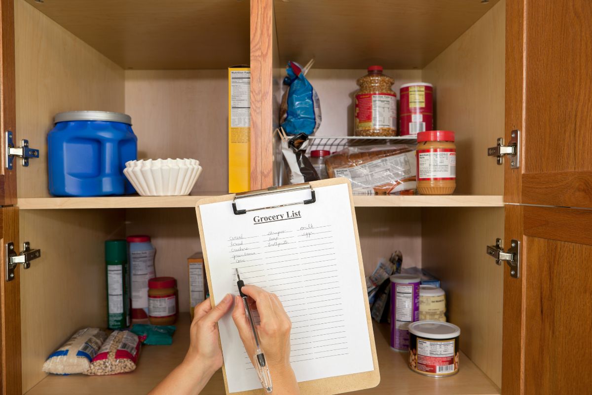 The picture of different products in the cabinet and a girl writing on the clipboard which means shop your pantry before going to the store helps reduce waste and saves money.