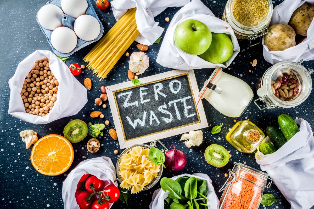 Photo of ingredients, fruits, vegetables, and a board with zero waste wording.