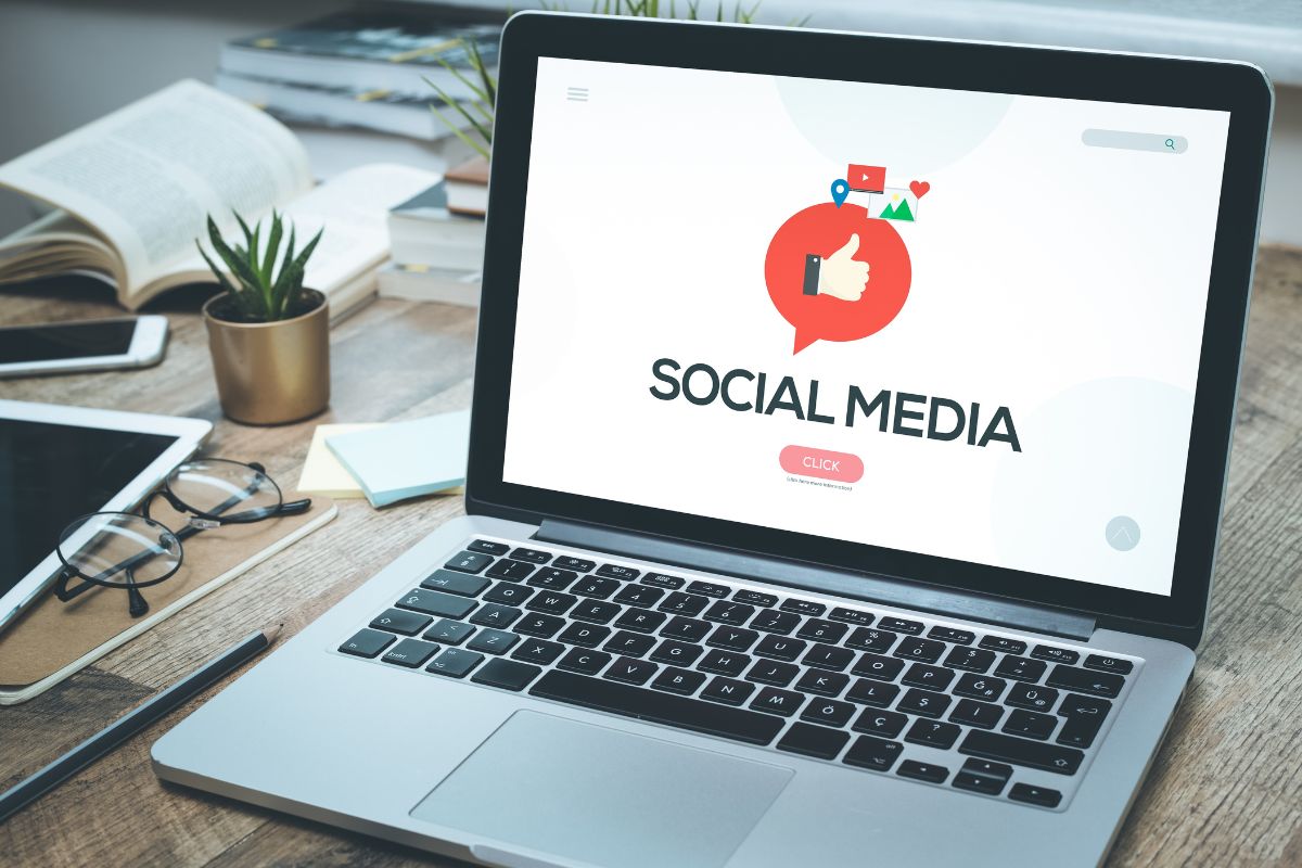 The photo tells about books, a phone, a plant, a tablet, an eyeglass, and a laptop with a screen display referring to learning skills that help build a strong personal brand can increase your earning potential.