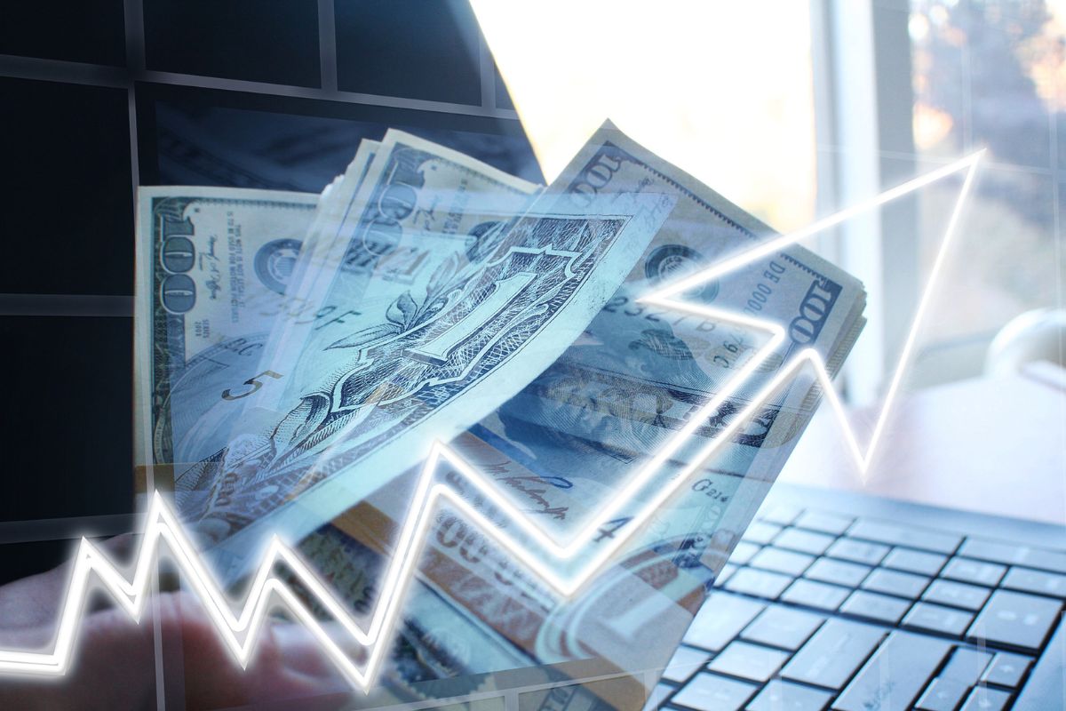 An image of income streams and a laptop.
