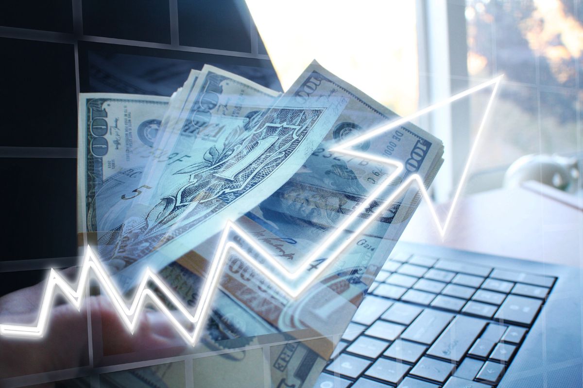 The photo shows a laptop, dollar bills, and a visual arrow up referring to creating multiple income streams, which means more opportunities to save and invest.