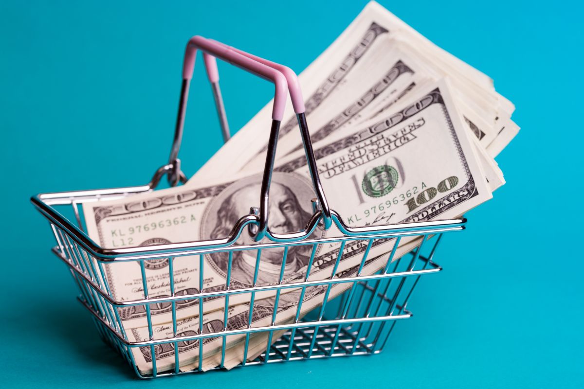 The photo of a cart and money.