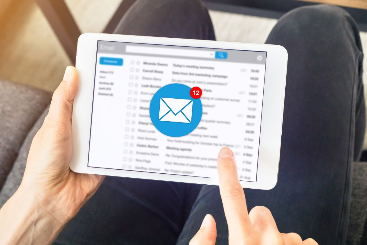The photo shows a man's hand using a tablet with a message icon referring to limiting morning spending triggers leading to better money choices throughout the day.