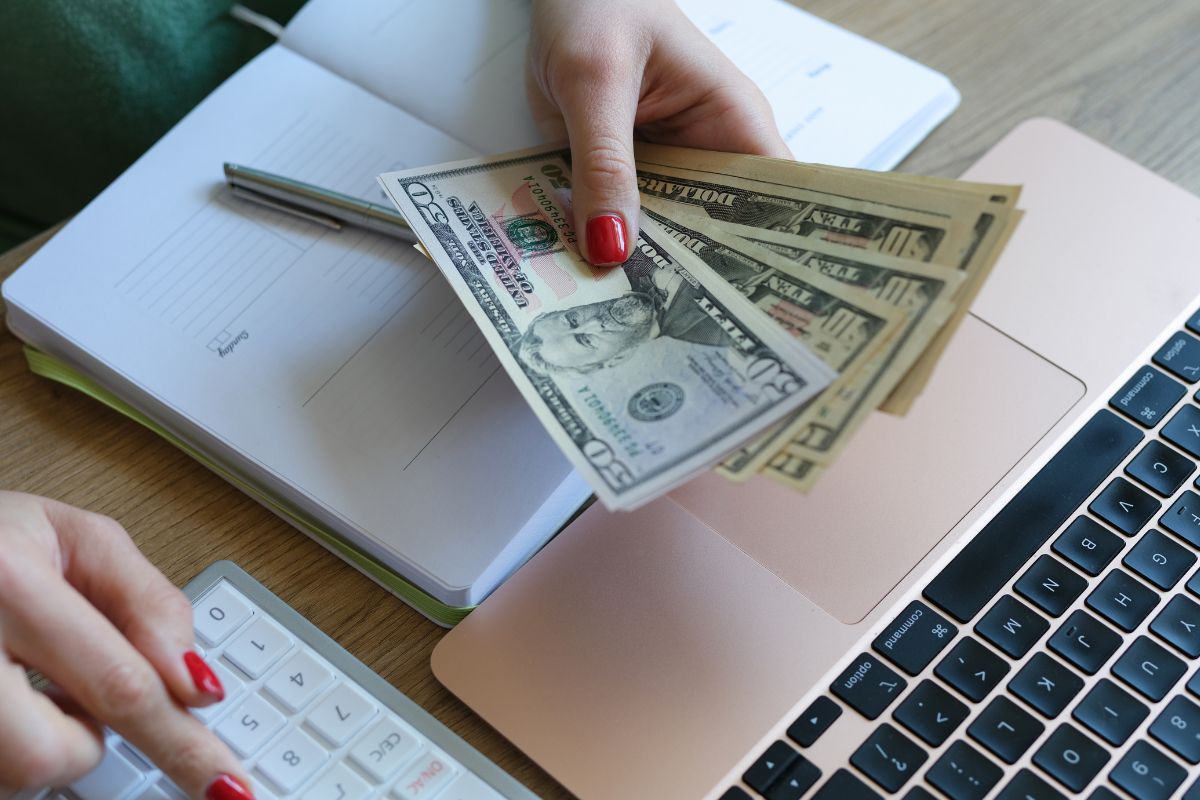 The image shows a woman creating a buffer for expenses.