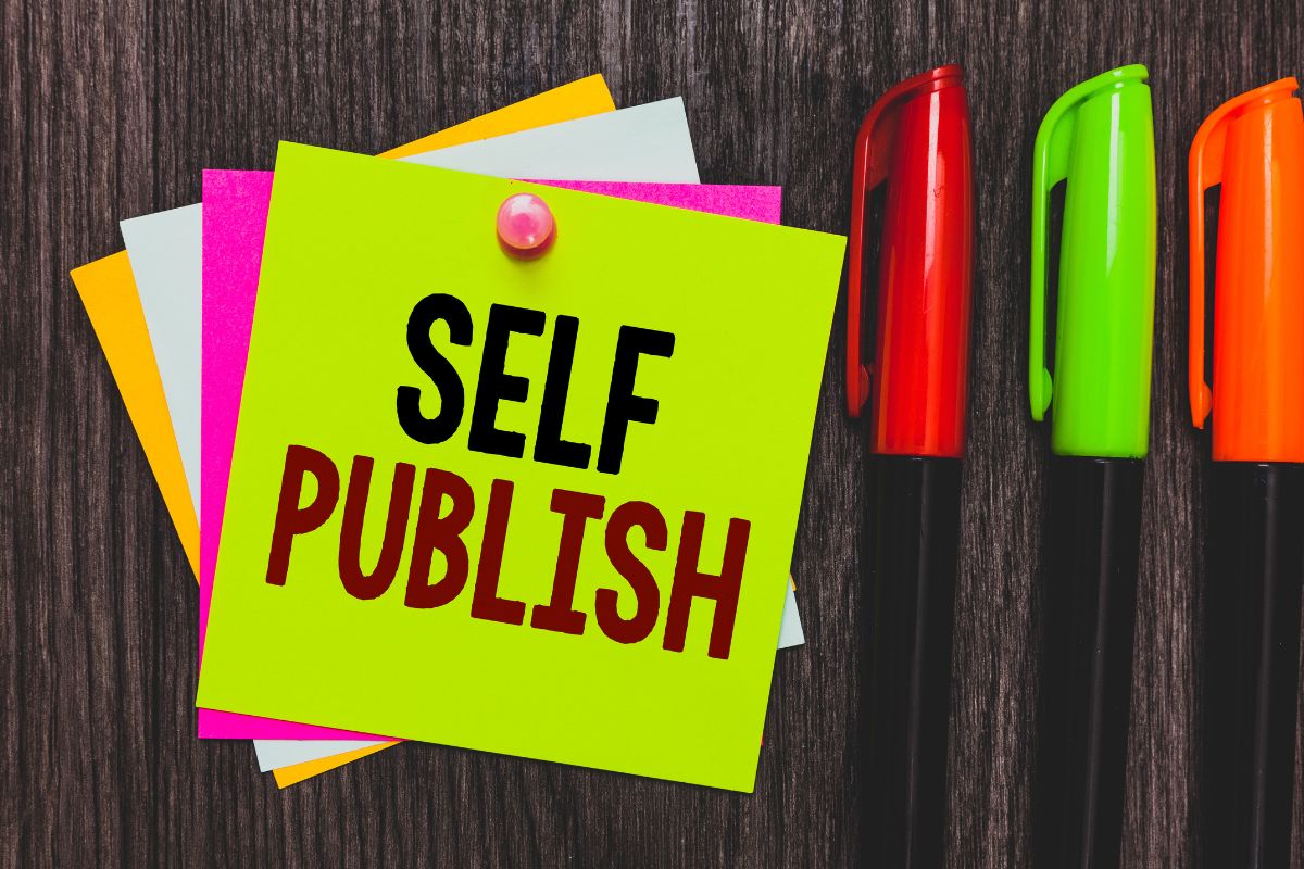 Image of pens and paper with self-publish wording.