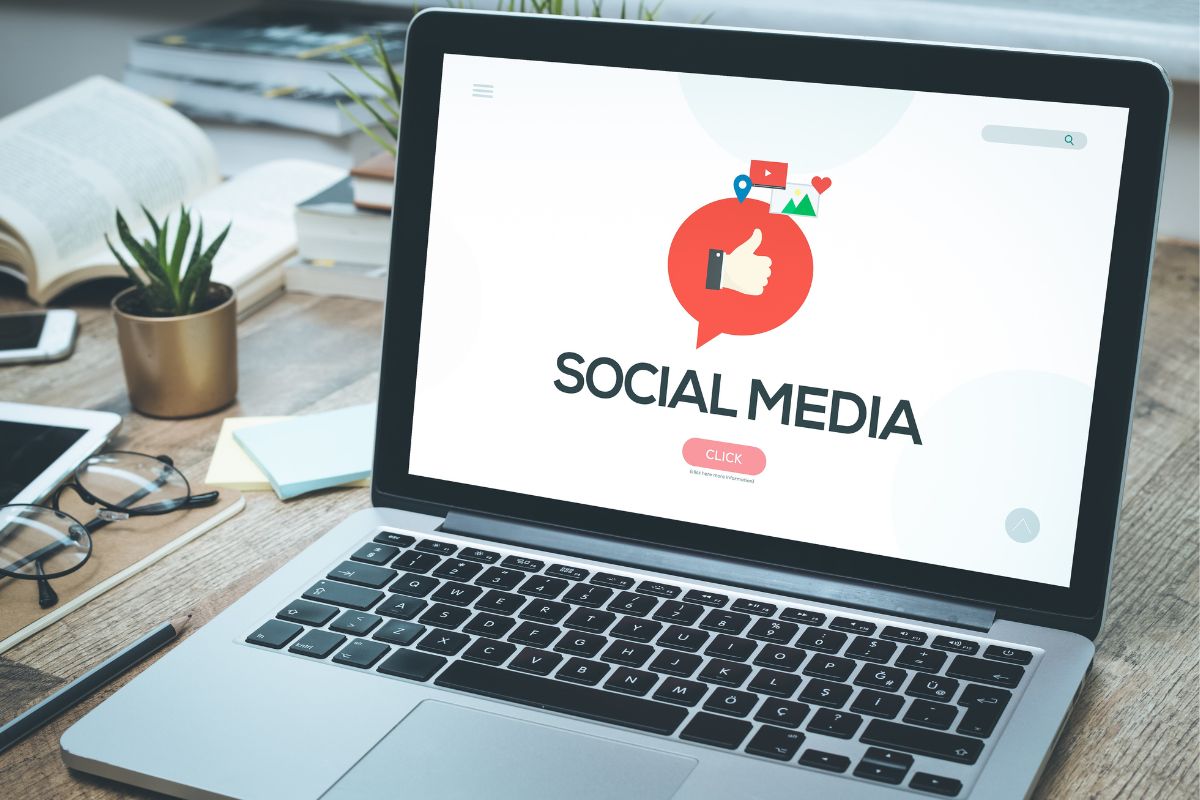 Image of a laptop with a social media display.