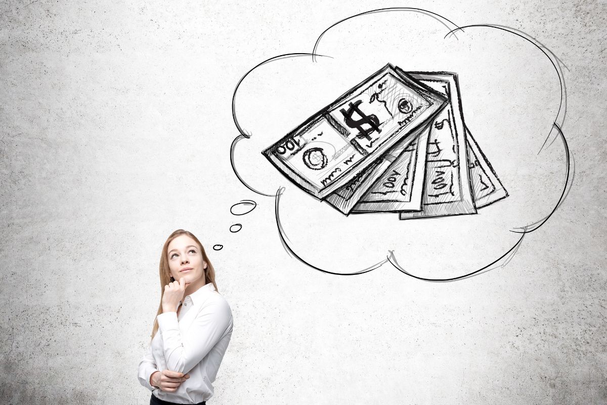 The photo tells about a girl thinking about money which refers to visualizing financial success with gratitude, which makes financial success feel more possible.