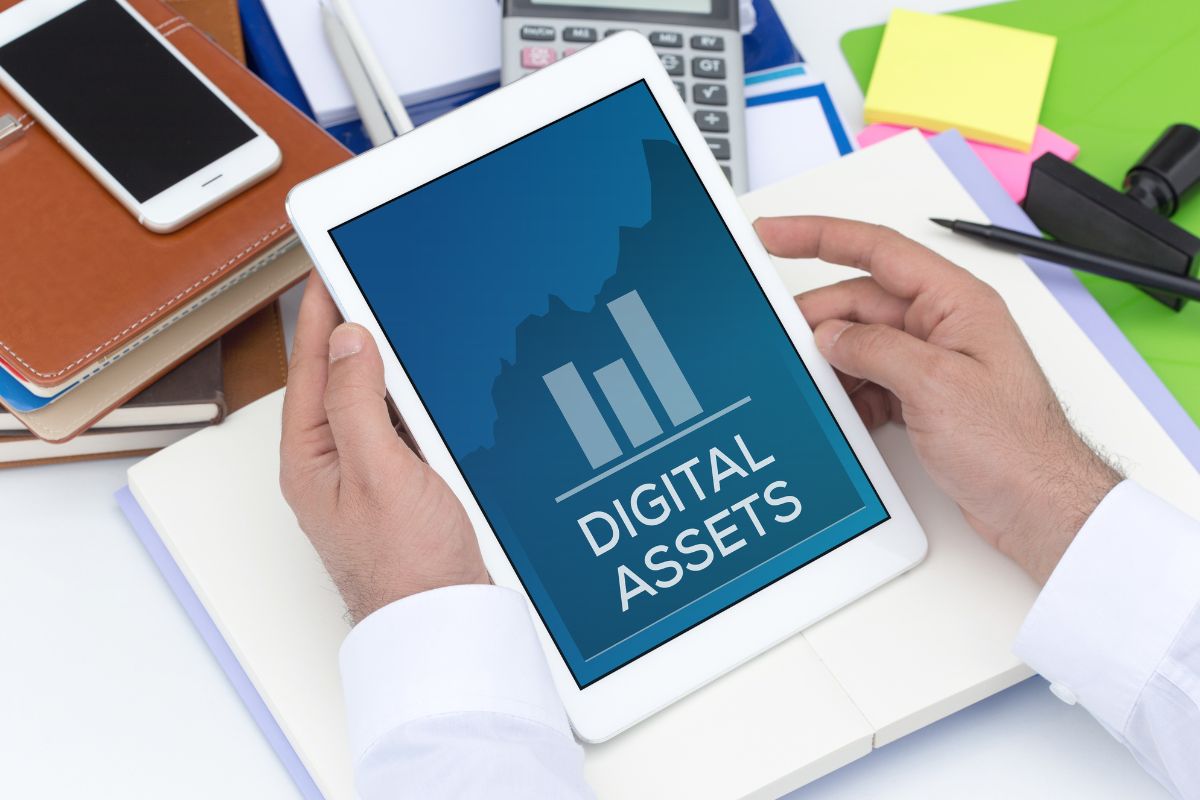 Photo of a man's hand renting out digital assets.
