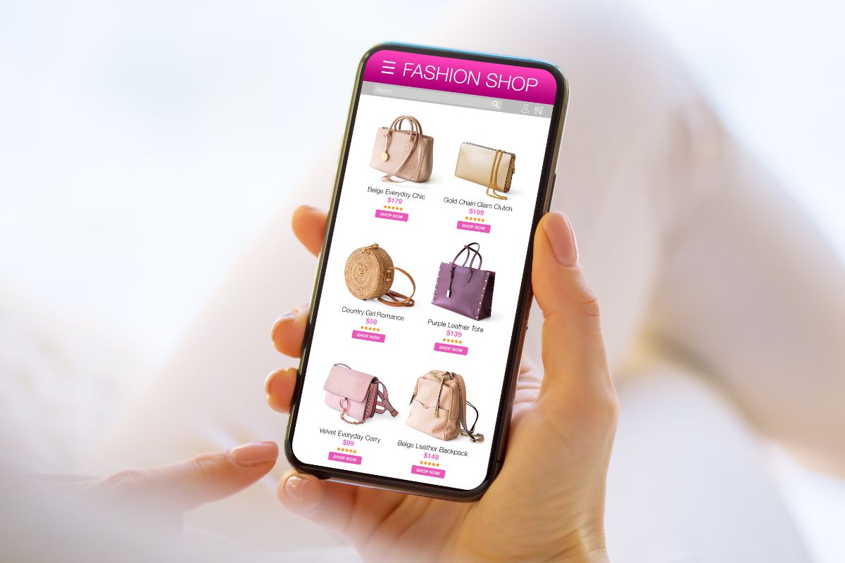 The photo shows a woman's hand while online shopping.