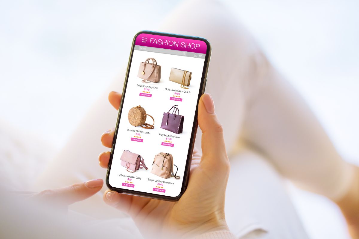 The picture tells about a girl's hand holding a phone with a screen display which refers to skipping impulse online shopping for a month to save money and stick to a list and only buy what's necessary.