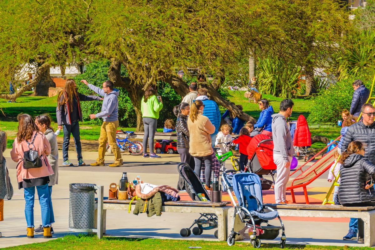 The image shows a group of people at the park.