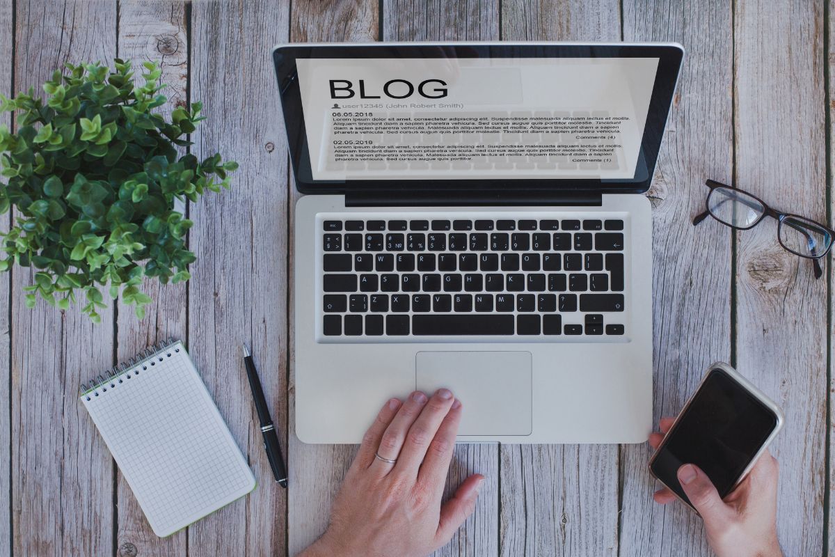 The picture shows a man's hand monetizing a blog.