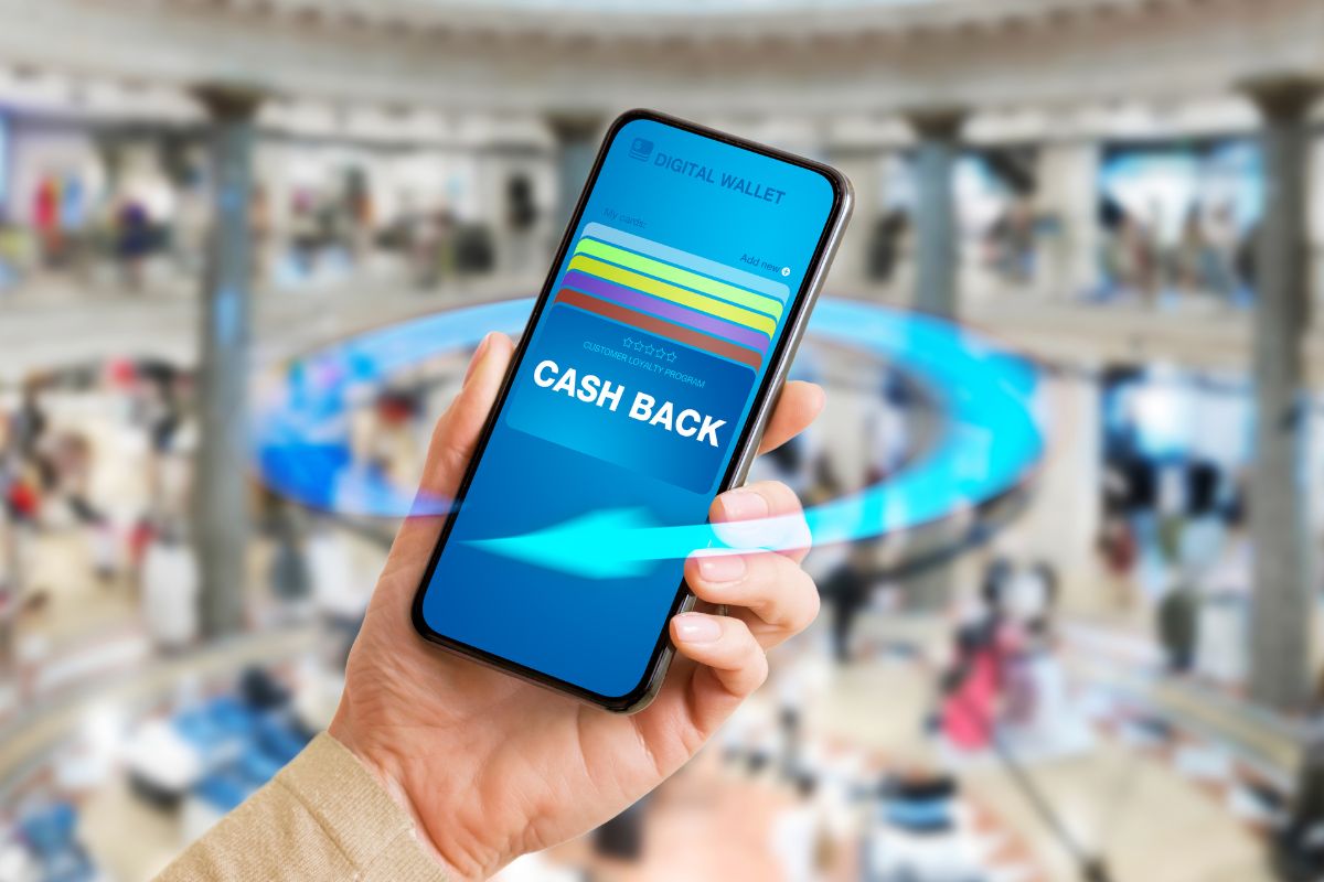 The picture of a woman's hand using a cash back.