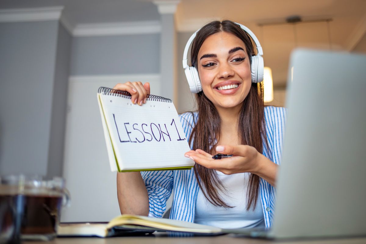 The picture of a woman tutoring online.