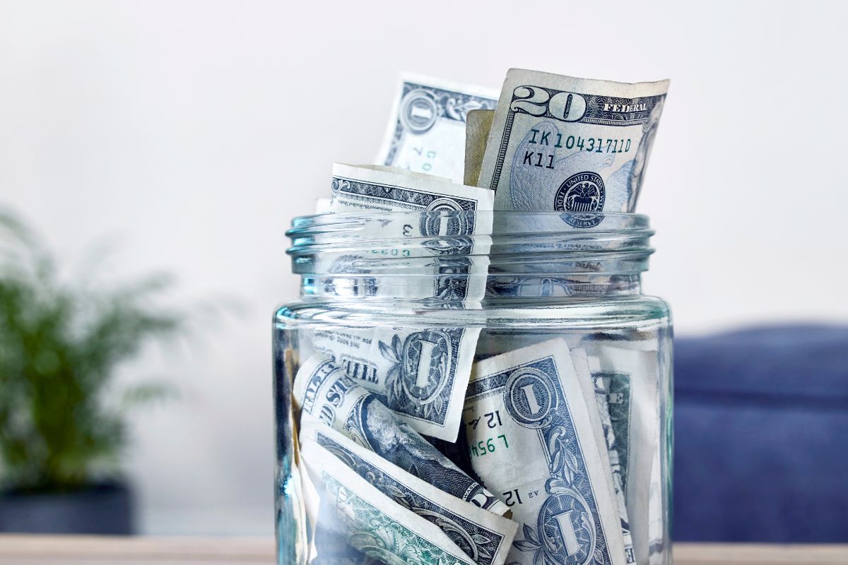 The picture of a jar of savings.