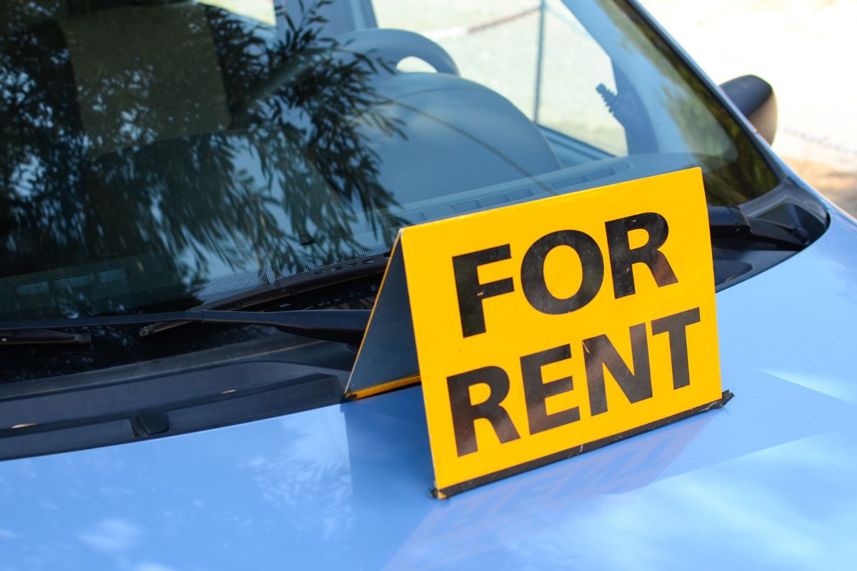 The photo shows a sign for a rental car.