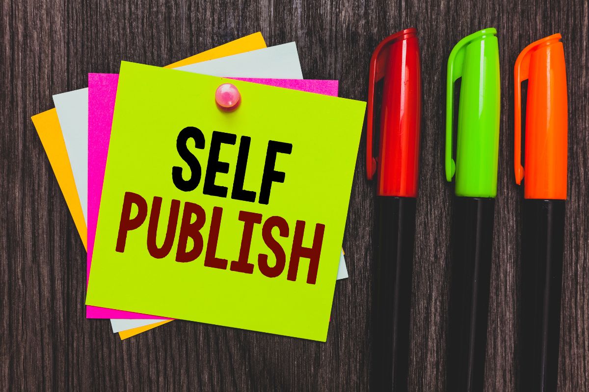 The image tells about colored markers and papers with notes which refers to self-publishing books on online platforms is a great way to earn money without spending money upfront.