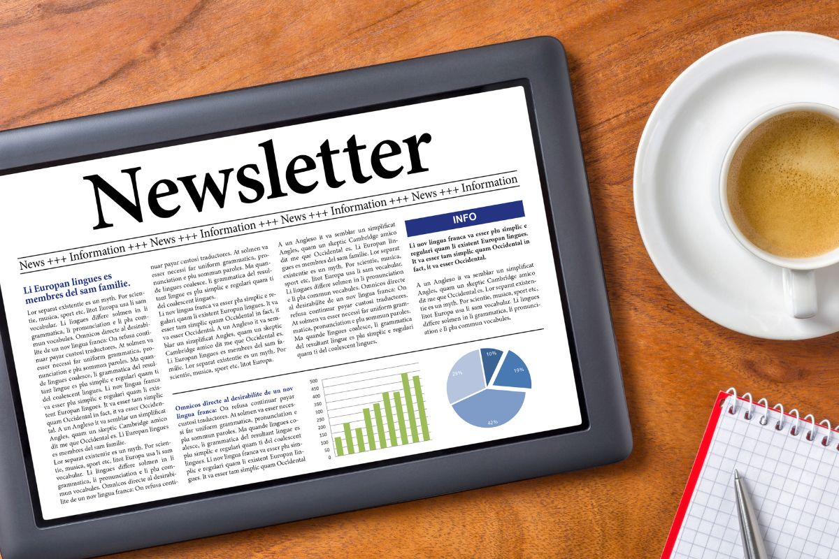 The photo of a tablet with a newsletter screen display.