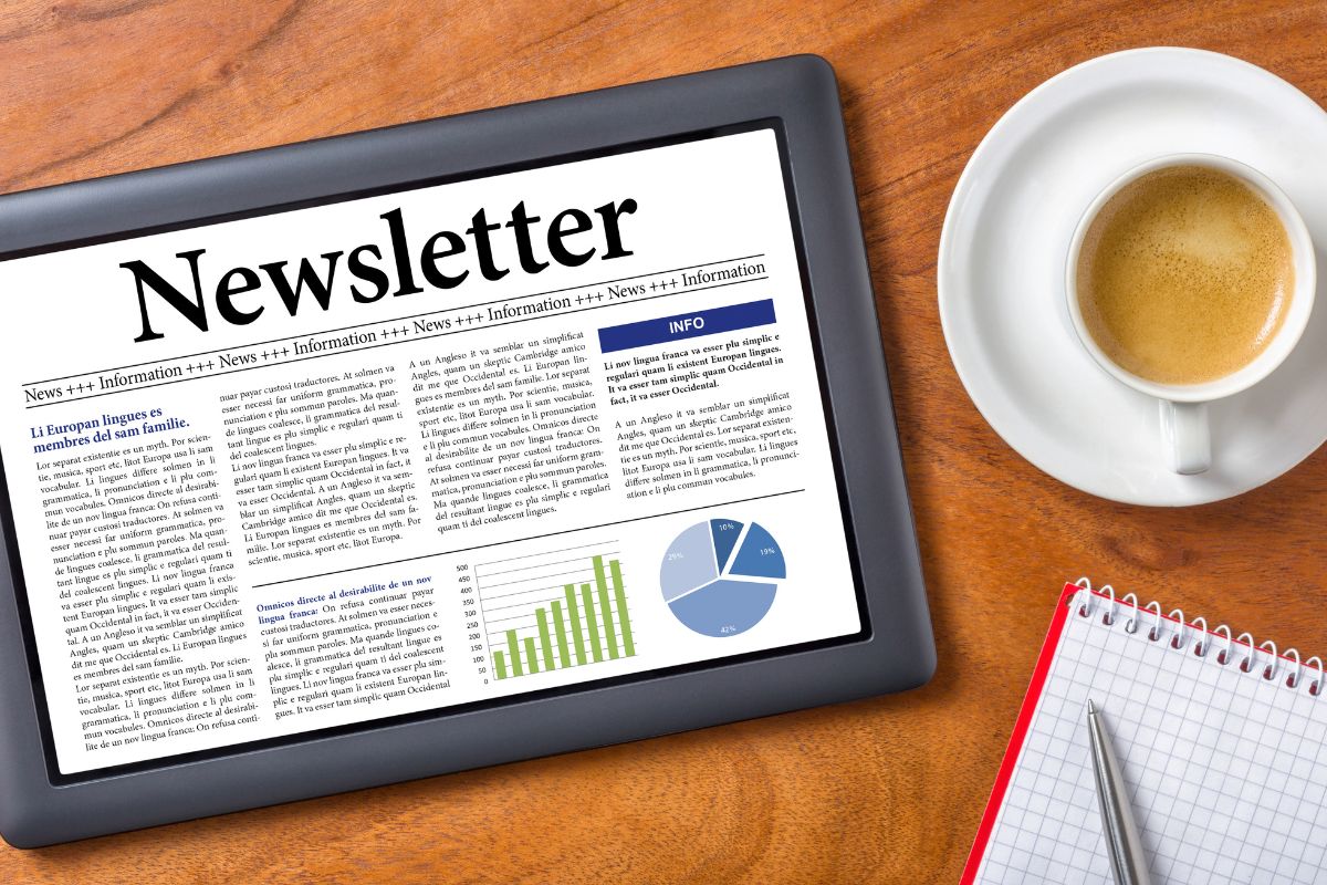 The image shows a coffee, a notebook, a pen, and a tablet with a screen display indicating that writing and selling newsletters on Substack is an easy way to start online work if you're good at sharing useful or interesting content. 
