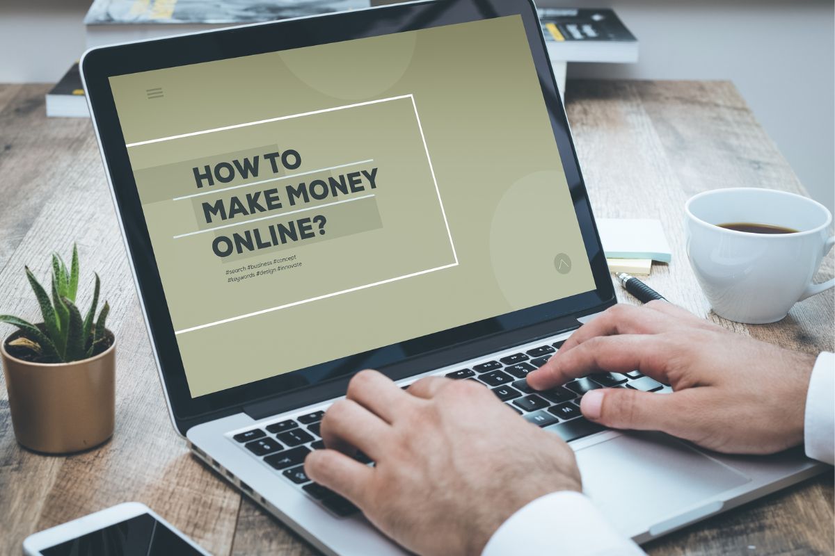 A man's hand searching for how to make money online.