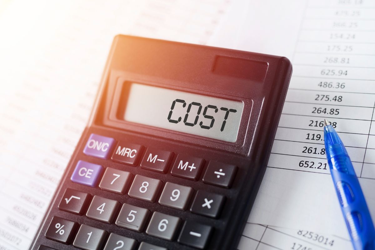 The image tells about a pen, a paper with numbers and a calculator with a note referring to considering the closing costs and fees associated with refinancing helps you decide if refinancing will truly save you money.
