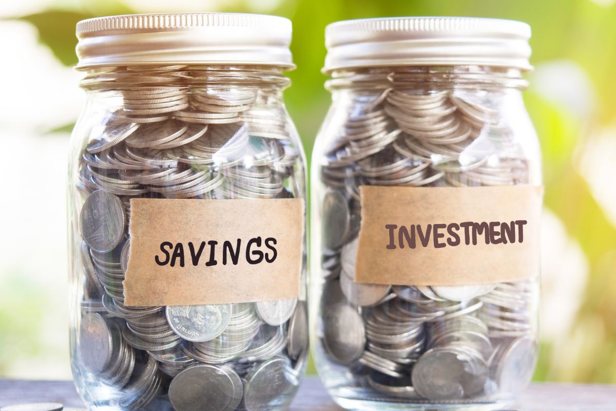 Image of a jar with savings and investment coins.