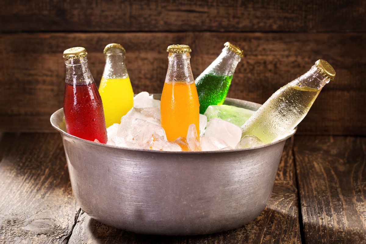 The photo of a metal bucket with ice and bottled soda is one of the easiest ways to waste money at the store.