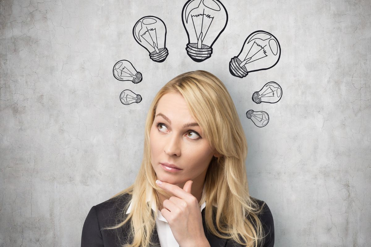 The photo shows a girl thinking with bulbs illustration in her head which means entrepreneurial thinking helps you see opportunities where others see obstacles,