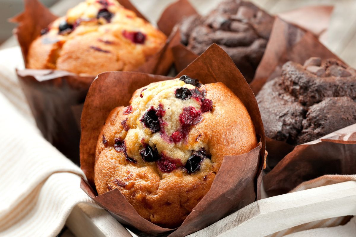 The image tells about the muffin in a tray which refers to store-bought baked goods cost way more than homemade, making your own at home let you control ingredients and avoid unnecessary additives.