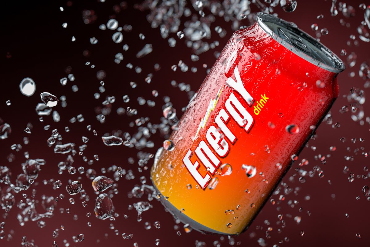 The photo tells about a can with notes and splash water indicating that energy drinks eat up a grocery budget fast, cutting these out is an easy way to save money.