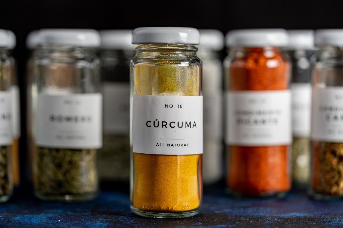 The picture tells about bottles with notes and flavors indicating that excessive condiments add up fast on a grocery bill, keeping it simple saves money and avoids waste.