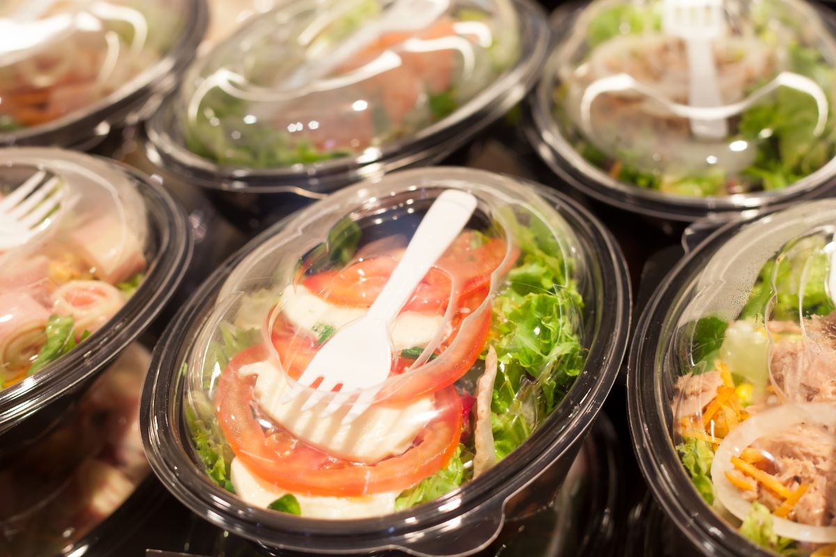 The photo shows packaged salad food.