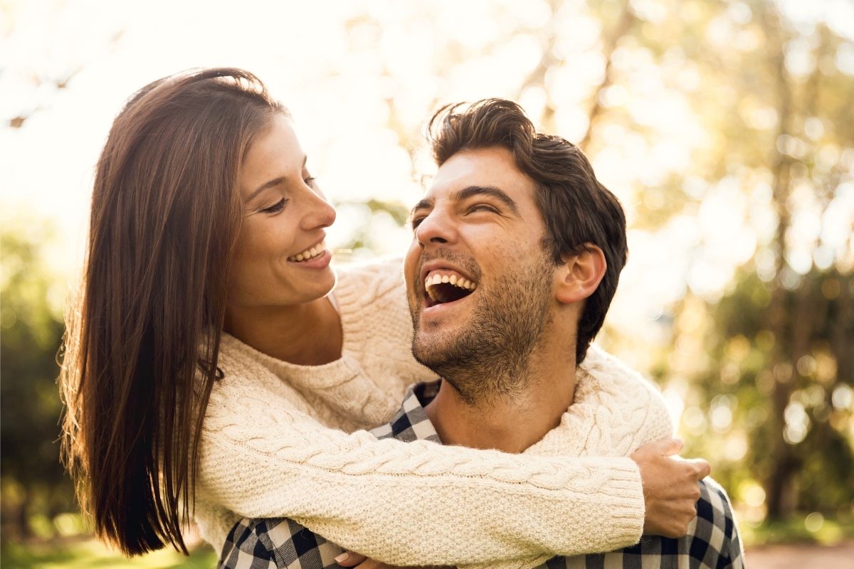 The photo shows a woman with her partner.