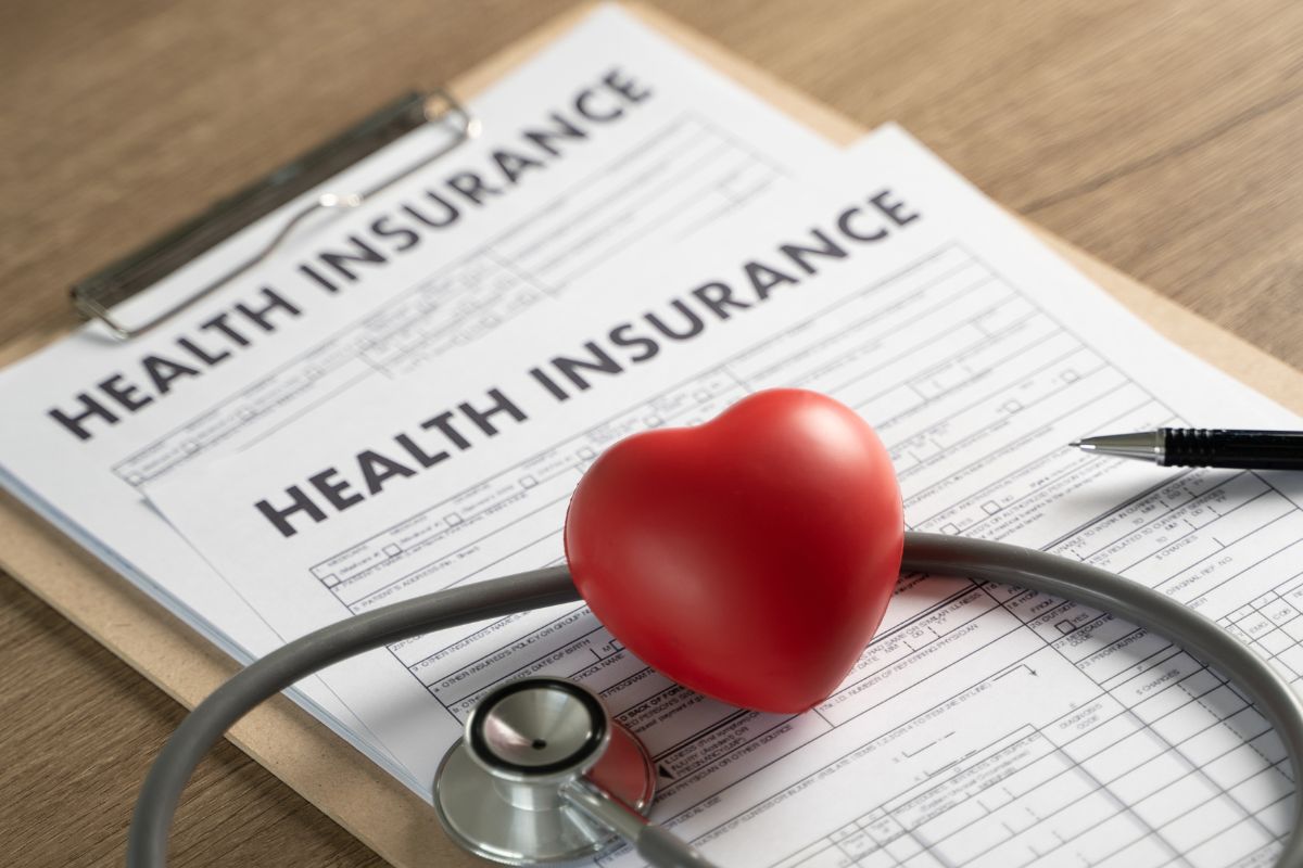 The image of a paper with health insurance wording.