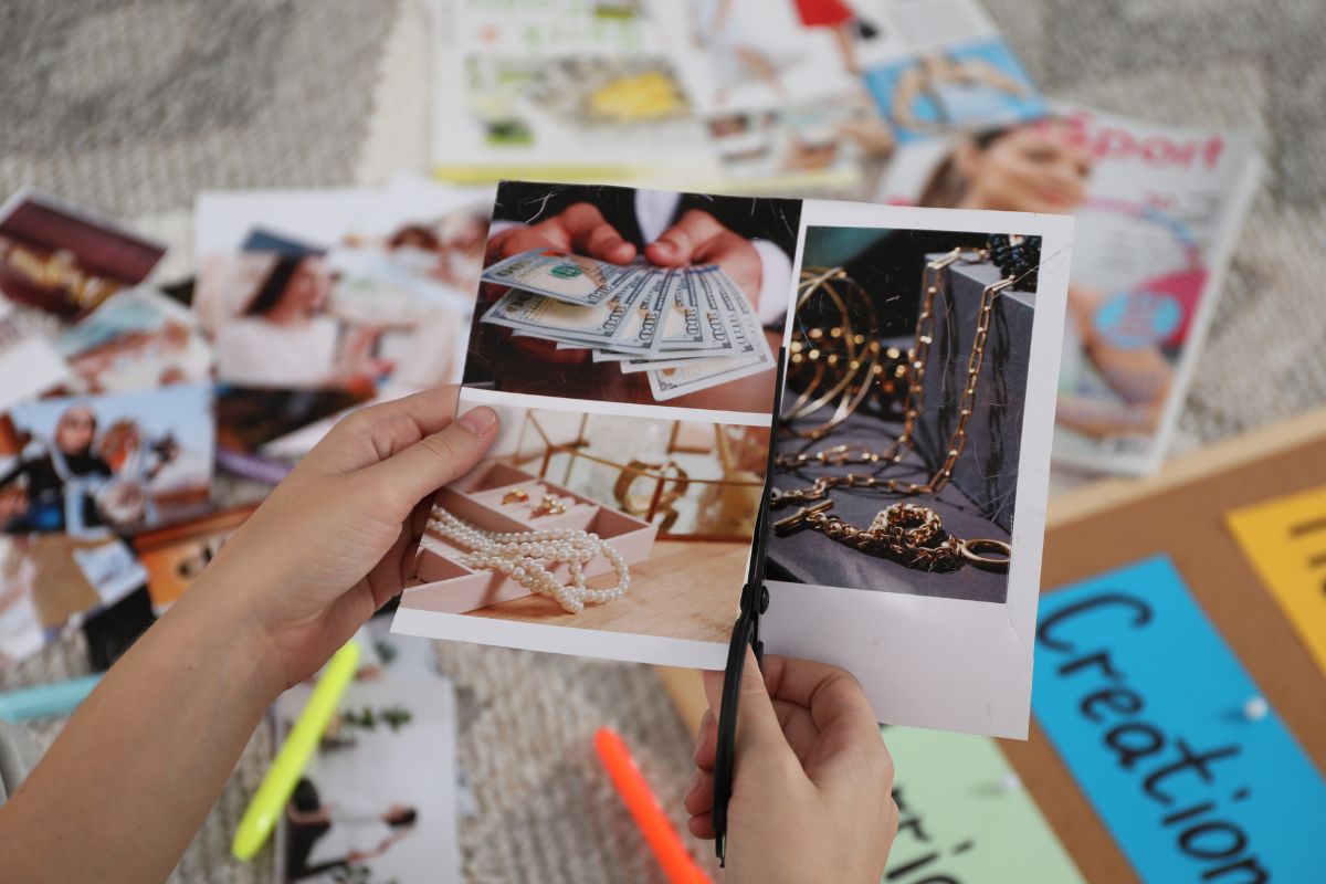 The picture shows a woman's hand making board pictures.