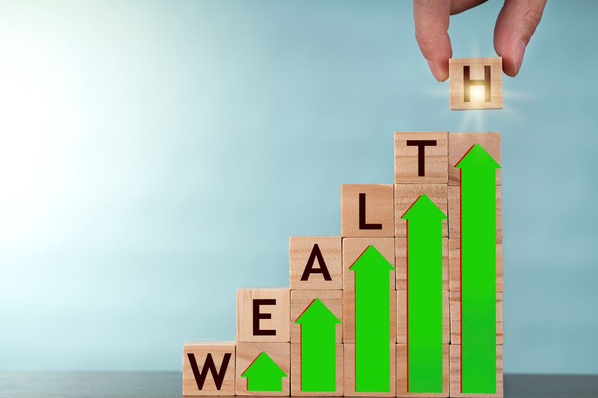 The picture shows a man's hand building wealth.