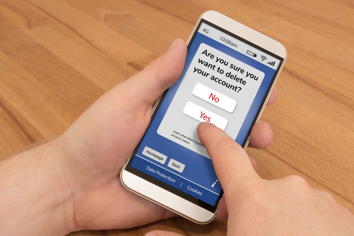 The photo of a man's hand using a phone.