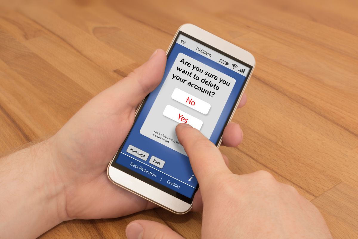The image shows a man's hand using a phone with a screen display indicating to avoid temptation keeps your focus on saving money.