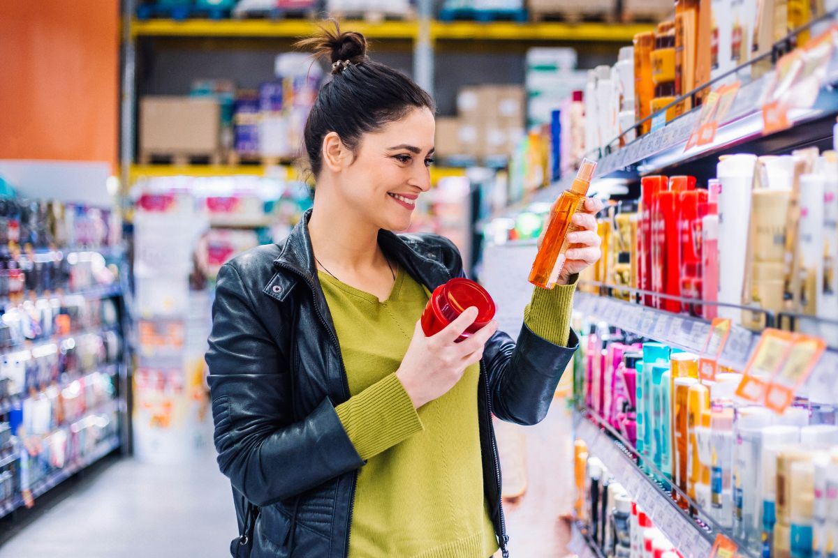 An image of a woman buying at the store.