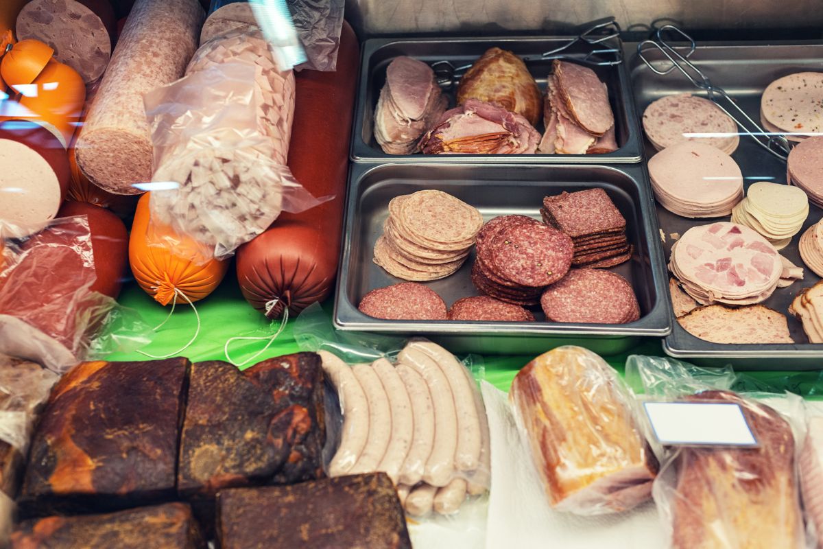 The photo of different varieties of meat foods in the containers which refers to limiting processed and convenience foods leads to healthier eating while keeping grocery costs low.