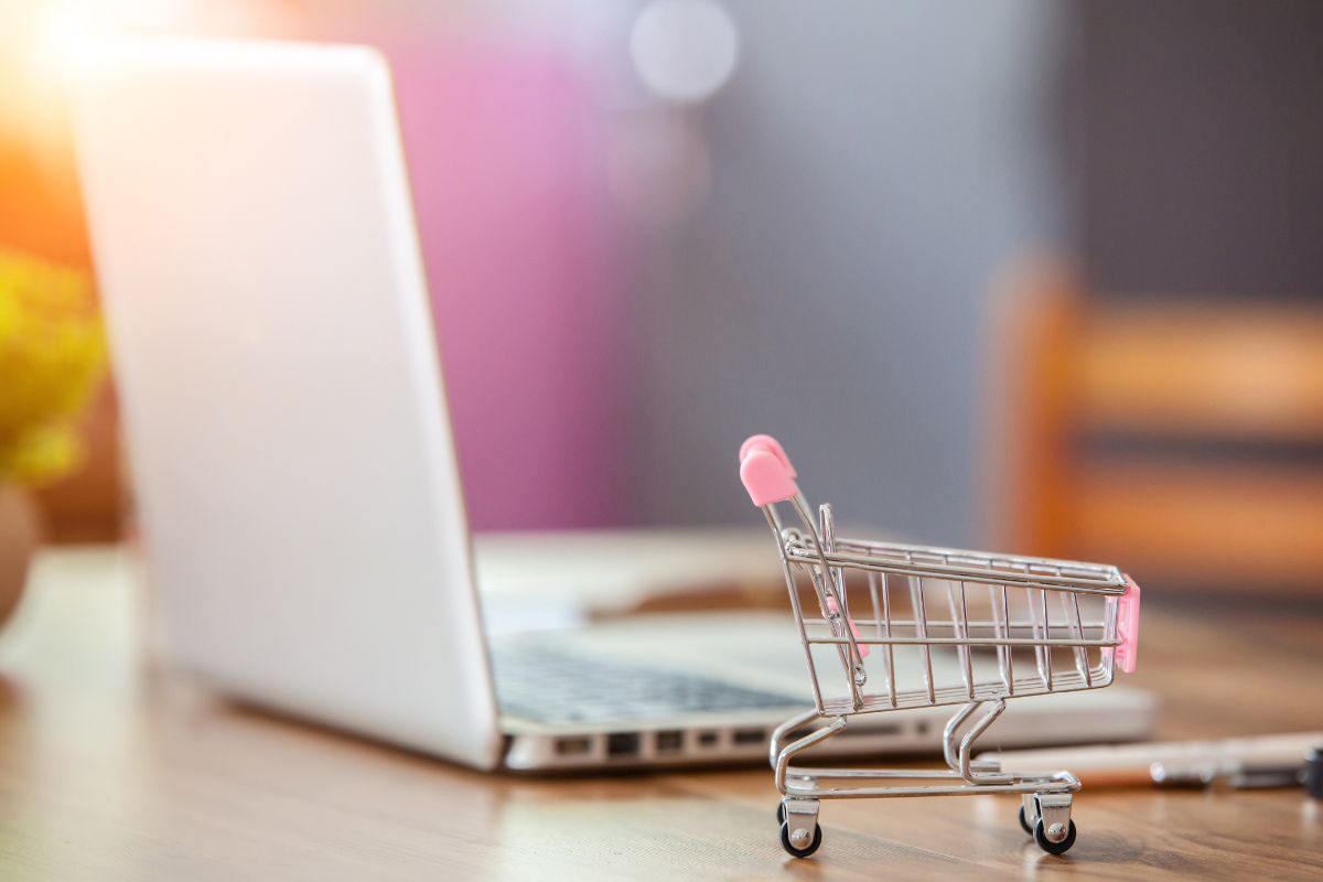 The photo of a laptop and a cart.