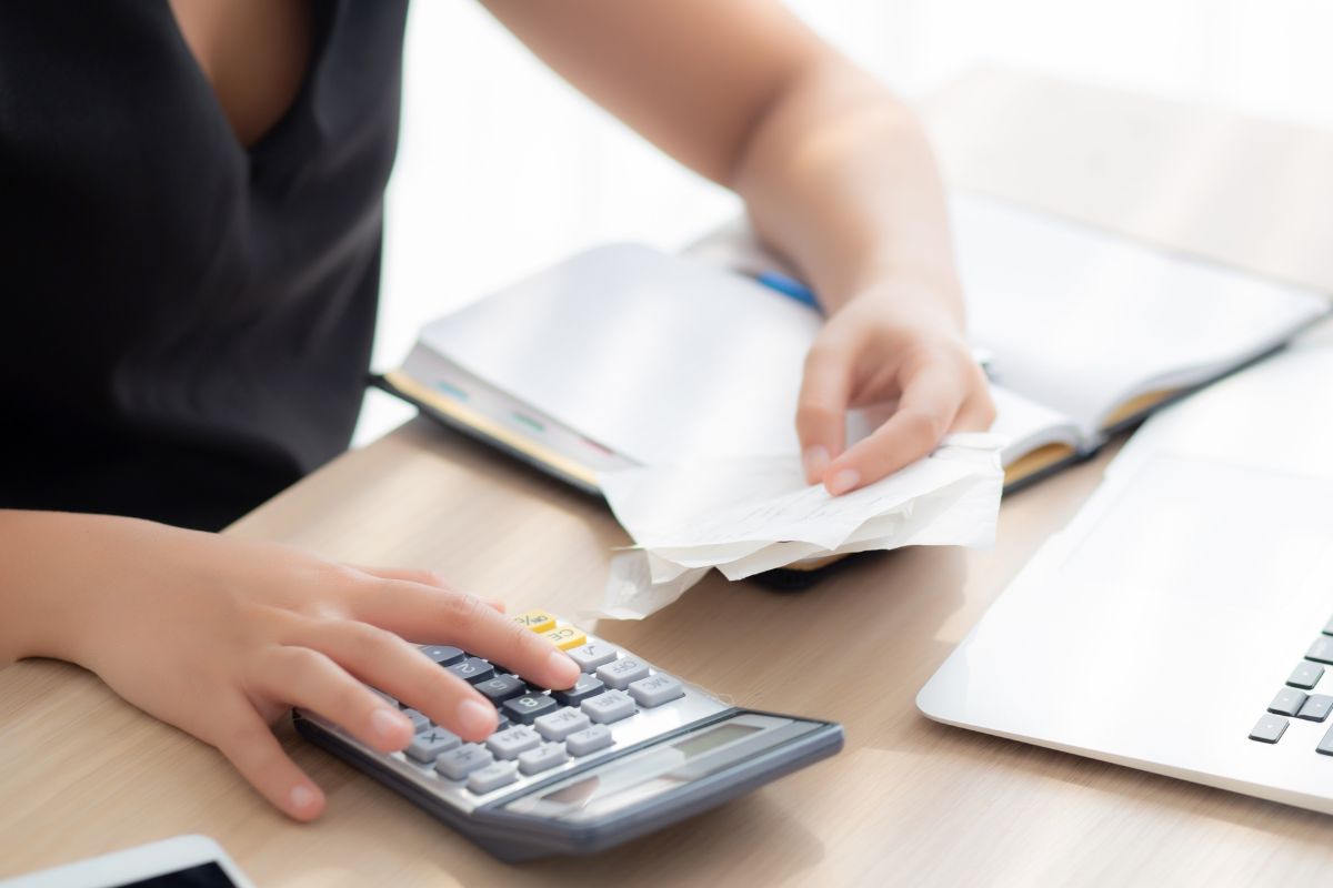 A photo of a woman tracking her expenses.