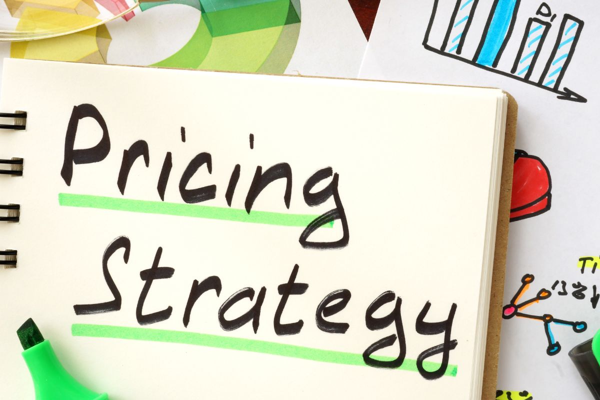 The picture shows a notebook with pricing strategy wording.