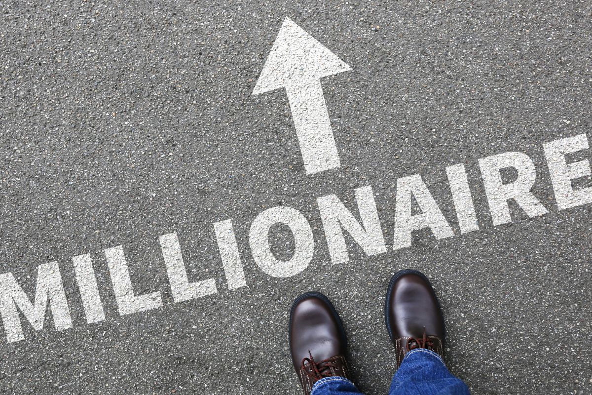 The image shows a man's foot and millionaire wording.