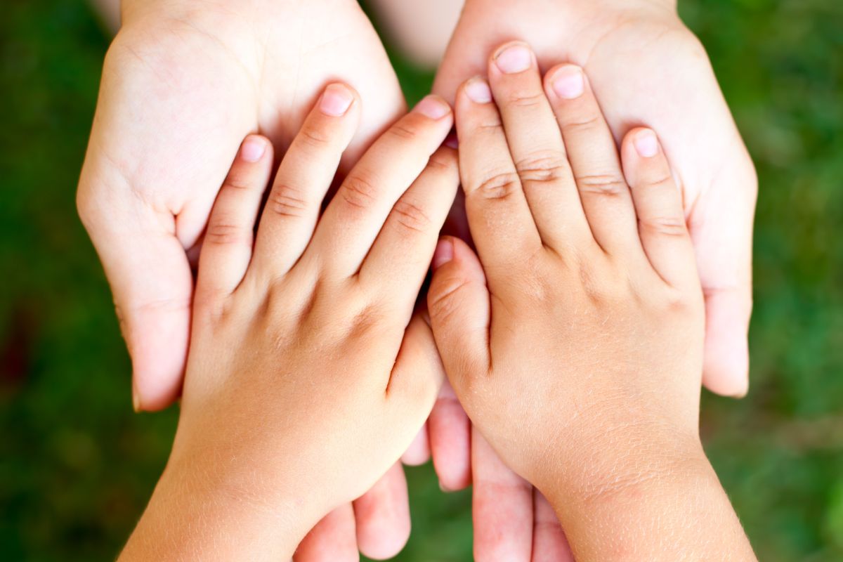 The picture tells about a mother and child's hands which means providing for a child's basic needs is already a huge responsibility and many students find ways to fund college on their own through financial aid and part-time work.
